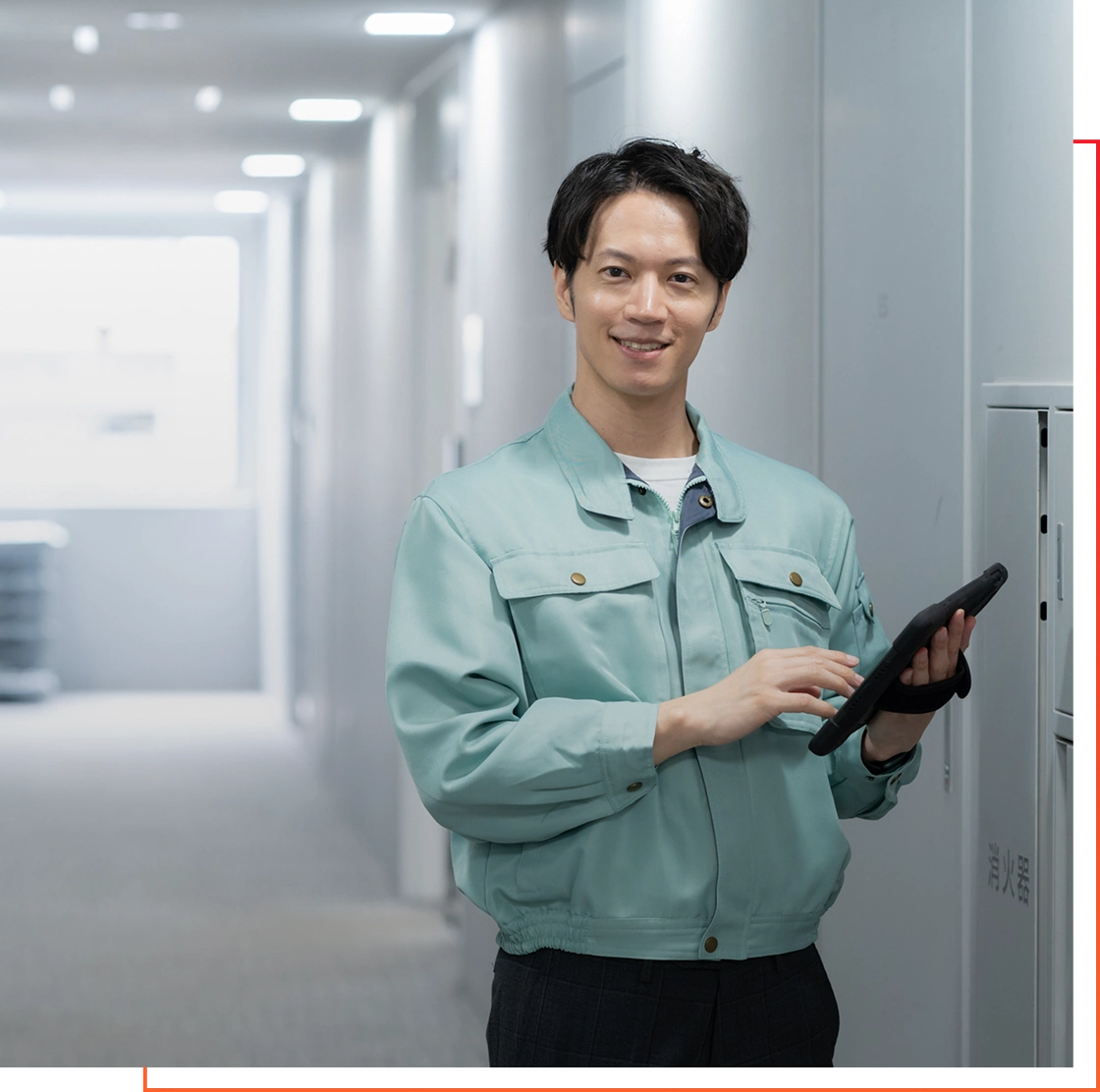 Worker in uniform with tablet indoors